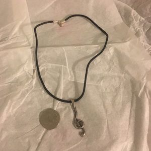Treble cleft pendant with leather necklace
